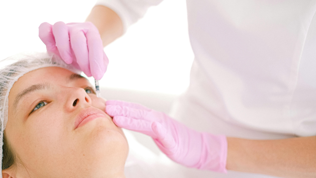 Facial rejuvenation procedure using Sculptra biostimulatory injections to improve skin texture and volume.